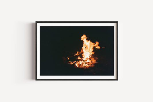 Framed photograph of a fire against a black background