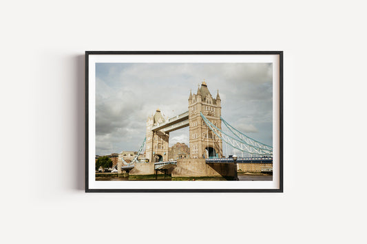 Framed photograph of Tower Bridge under a cloudy sky